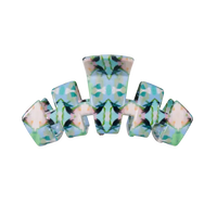 A multi-piece hair claw clip set featuring a symmetrical, mirrored pattern of light blue, mint green, and soft pink with dark green leaf-like accents, shown on a plain white background.