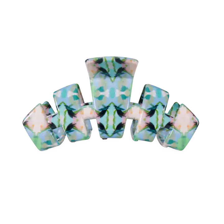 A multi-piece hair claw clip set featuring a symmetrical, mirrored pattern of light blue, mint green, and soft pink with dark green leaf-like accents, shown on a plain white background.