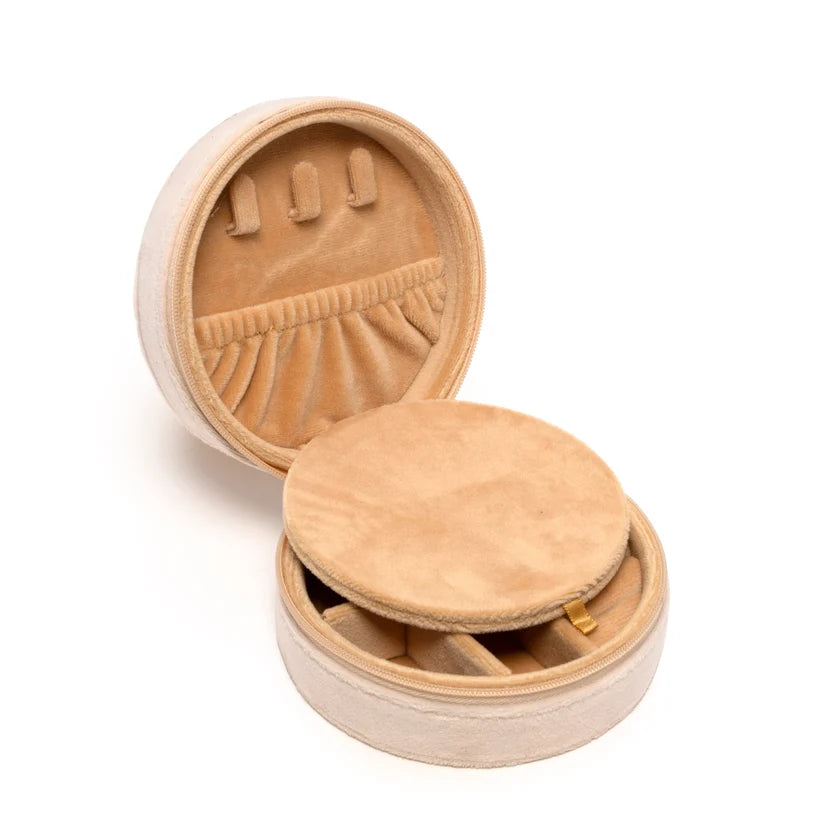 Round wooden jewelry box with open lid on a white background