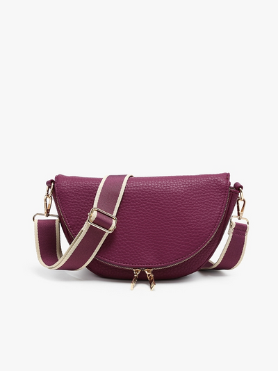 A burgundy pebbled leather crescent-shaped crossbody bag with a matching shoulder strap trimmed in gold, shown against a plain white background.