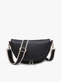 Black pebbled leather crescent-shaped shoulder bag with a wide black and white striped strap and silver-tone hardware, shown on a plain white background.